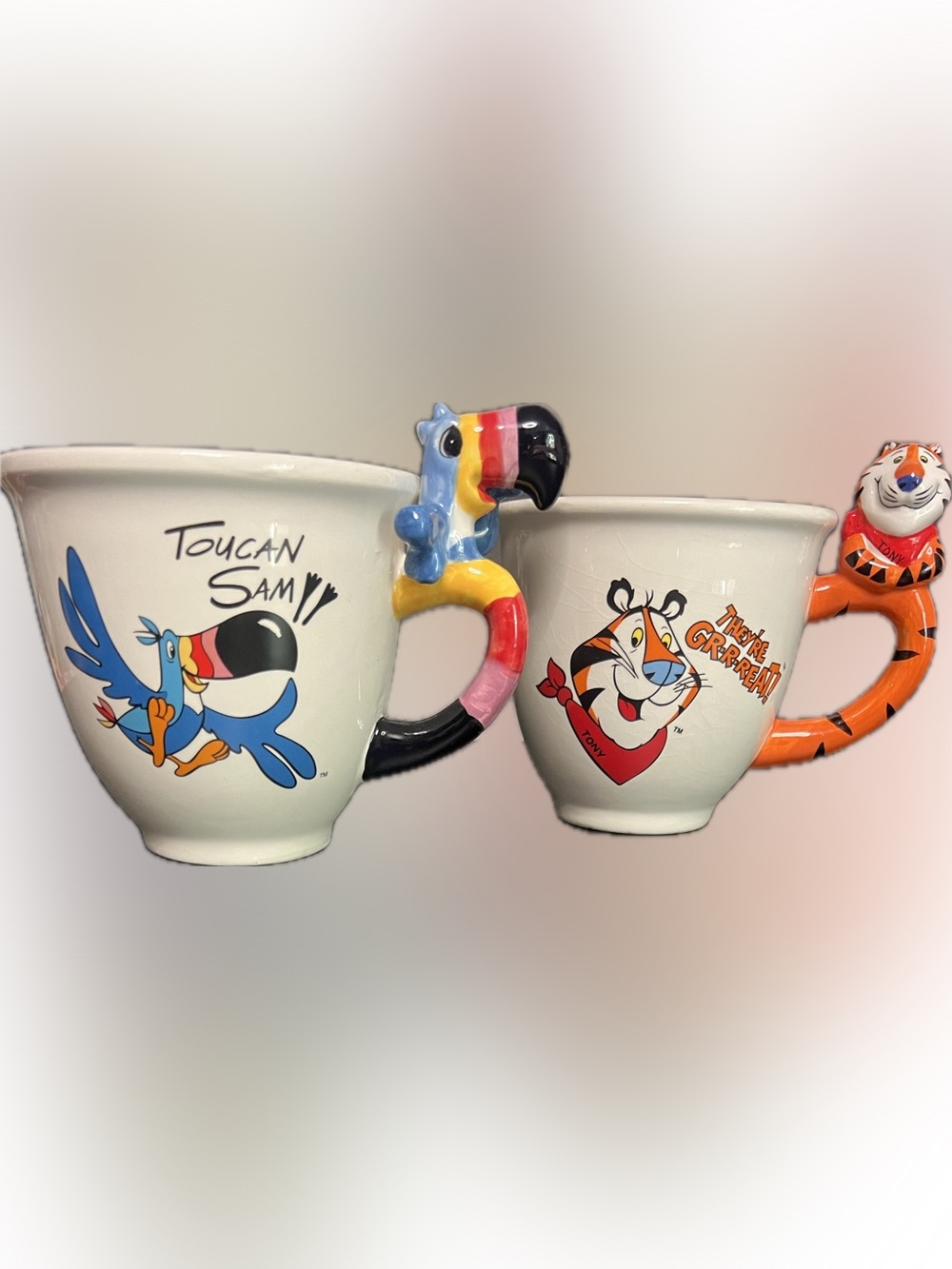 2 Kellogg character mugs: Tony the Tiger & Toucan Sam-16oz ea-EUC/Tony tiny chip
